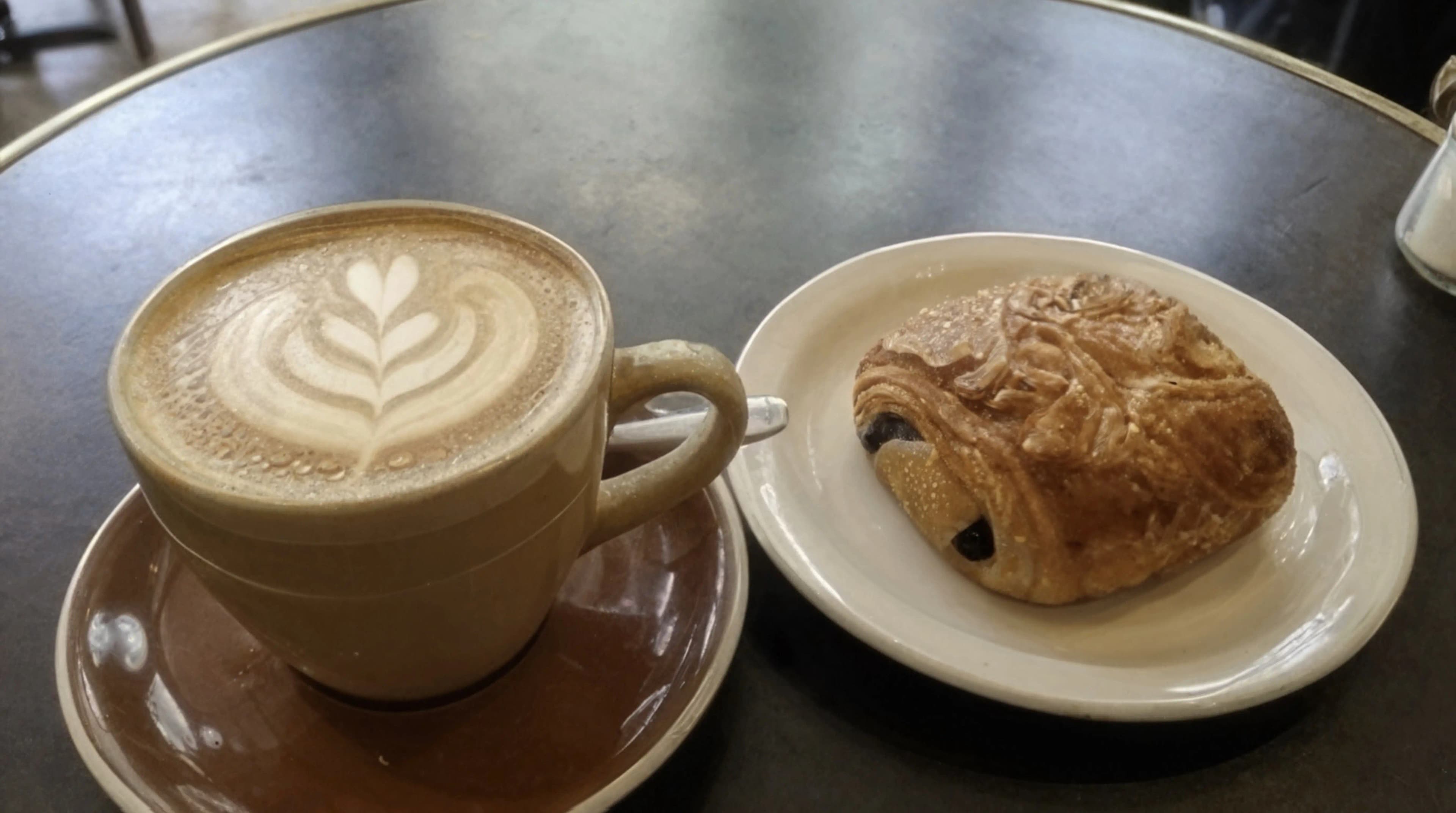 Before AI enhancement: Unprocessed amateur café interior photo